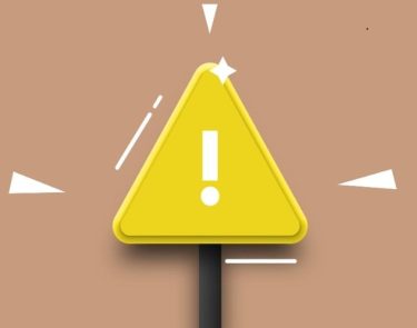 white exclamation point on yellow triangle